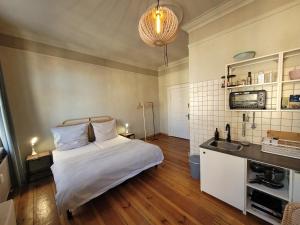 a bedroom with a bed and a sink in it at Lioba in Ueckermünde