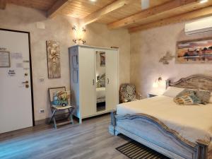 a bedroom with a bed and a chair in it at B&b Il Rustico in Sestri Levante +107 photos