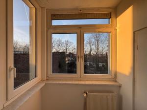 a window in a room with a view of trees at Living - Ferien & Monteur Appartement in Wuppertal