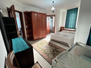 a bedroom with a bed and a dresser at Dalyan Villa in Dalyan +19 photos