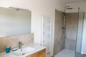a bathroom with a sink and a shower at La villa Cigaliere in Tulette +14 photos
