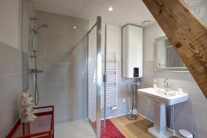 a bathroom with a shower and a sink at Le Clos des Soyeux in Saint-Victor-sur-Rhins +84 photos