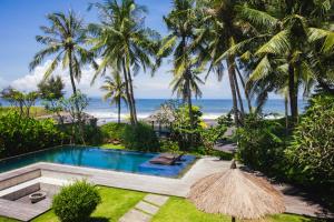 a view of the beach from the villa at K Ko Surf Village at Keramas in Lebih