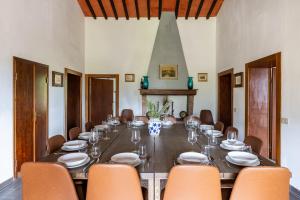 a large dining room with a long table and chairs at Podere le Lune with Pool, San Gimignano in San Gimignano