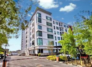 a white apartment building with a lot of windows at Zen66 @ Roxy Serviced Apartment in Kuching