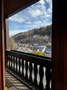 a view of a town from a balcony at Linnenkerlstube in Willingen