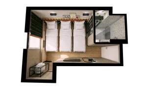a floor plan of a small room with a desk at Hôtel EH OH Orly Rungis in Rungis +21 photos