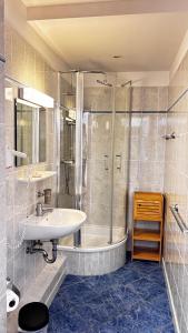 a bathroom with a tub and a sink and a shower at Hotel La Bastide in Le Lavandou +102 photos