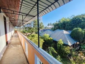 a view from the balcony of a building at The zen inn in Nikawatawana