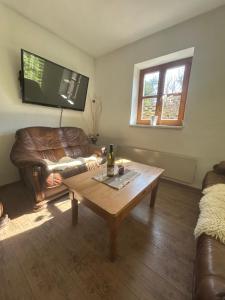 a living room with a couch and a coffee table at Andělský sklípek in Dolní Věstonice