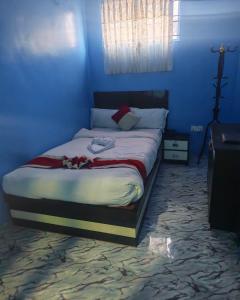 a blue bedroom with a large bed in a room at Hotel Aahar chitawan in Bharatpur +6 photos