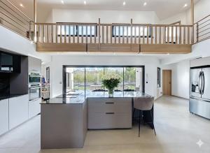a large kitchen with a large island in the middle at Maison de prestige à Grimaud in Grimaud