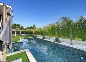a swimming pool in the backyard of a house at Maison de prestige à Grimaud in Grimaud