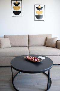 a black coffee table in a living room with a couch at The ViewPoint VP2 - Το διαμάντι της θέας in Mytilene