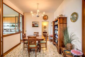 a dining room with a table and chairs at GOCCE VILLAS - Sunshine Villa in Massa Lubrense
