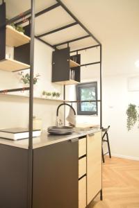 an office with a desk in a room at Blossoming Hidden Nest with Garden in Ljubljana +10 photos