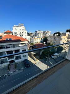 a view of a city from the balcony of a building at Luxury Lotus REZİDANCE 2oda1salon in Kyrenia