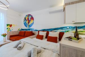 a bedroom with a large bed and a couch at PREMIUM Apartments Old Town in Košice