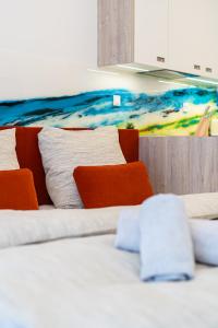 a room with two beds and a painting on the wall at PREMIUM Apartments Old Town in Košice +12 photos