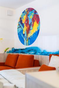 a room with a couch and a painting on the wall at PREMIUM Apartments Old Town in Košice