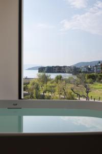 a window with a view of the water at Arcadia Small courtyard in Dali Shuanglang