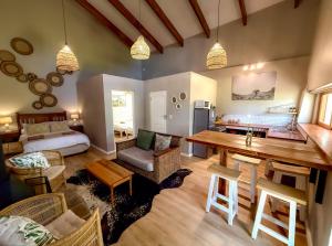 a large living room with a table and a couch at Pat Busch Mountain Reserve in Robertson
