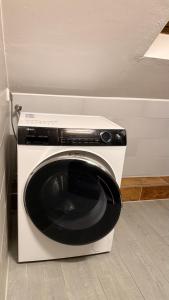a black and white washing machine in a room at Casino Hotel Hamm in Hamm