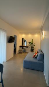 a bedroom with a blue bed in a room at ZENIT Appartamenti & SPA in Terni