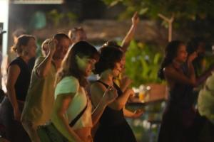 a group of people standing in a crowd at Paddle Cult Surf & Yoga in Varkala