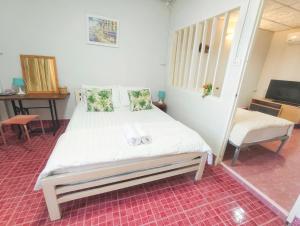 a bedroom with a bed and a tv in it at whole house for 5 guests 3 beds in Hat Yai +7 photos
