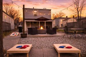 a backyard with a fire pit and a house at Derby & Bourbon Trail Homebase W Private Backyard in Louisville