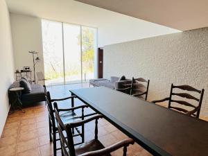 a living room with a table and chairs at Auberge de Oishi in Takamatsu +56 photos