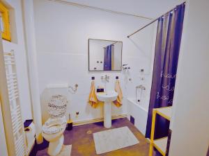 a bathroom with a toilet and a sink at Panorama Sky Apartment -11 min by walk to Old Town - Free Parking in Sarajevo