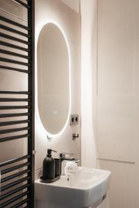 a bathroom with a sink and a mirror at Domeček U Potoka in České Budějovice +12 photos