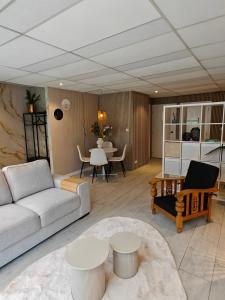 a living room with a couch and a table at Studio 13 in Dronrijp