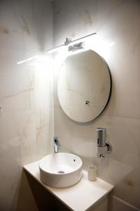 a bathroom with a white sink and a mirror at The ViewPoint VP3 in Mytilene +19 photos