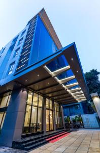 a large blue building with windows on the side at Hotel Star Place in Chennai