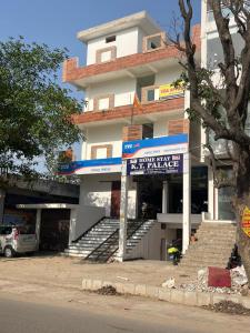 a building with a sign in front of it at HOMESTAY KT palace in Varanasi
