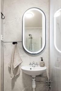a bathroom with a sink and a mirror at Negarden 1897 in Åsnes +53 photos