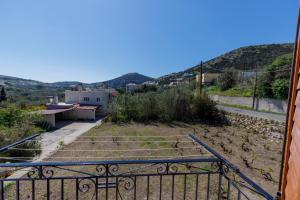 a view from the balcony of a house at La casa nel campo in Syros Island National Airport