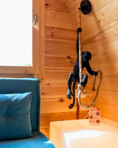 a monkey hanging from a rope in a room at Villa Yucca - Luxury Glamping Experience in Torano Nuovo +92 photos