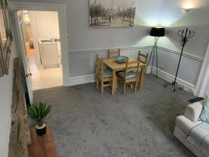 a dining room with a table and chairs in a room at Hursley Lodge in Lincoln