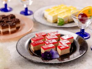 a plate of cakes and desserts on a table at Yokohama Sakuragicho Washington Hotel in Yokohama +60 photos