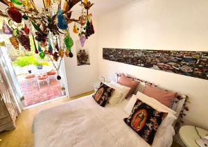 a bedroom with a bed with pillows on it at Django's in Riebeek-Kasteel +15 photos