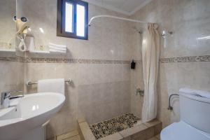 a bathroom with a shower and a sink and a toilet at Hotel Lago Dorado in La Savina +72 photos