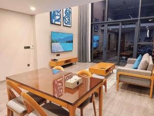 a living room with a dining table and a couch at Westlake view Duplex Studio in Hanoi