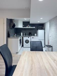 a kitchen with a table and two chairs in a room at City-Apartment Spreeufer im Herzen Berlins in Berlin