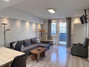 a living room with a couch and a table at City-Apartment Spreeufer im Herzen Berlins in Berlin