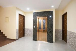 a hallway with two doors in a house at FabHotel Sager Inn in Gurgaon