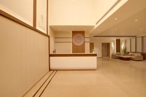 a lobby with a reception desk in a building at Keys Select by Lemon Tree Hotels, Amritsar in Amritsar